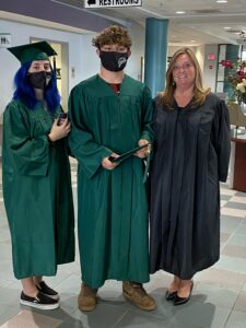 Abigael Aaron and fellow classmate, Zacheriah Pullins pose with Demme McManus, OFTC's Dean of Adult Education during OFTC's Spring 2021 Commencement Filming. Both obtained their high school equivalency and graduated with their GED.