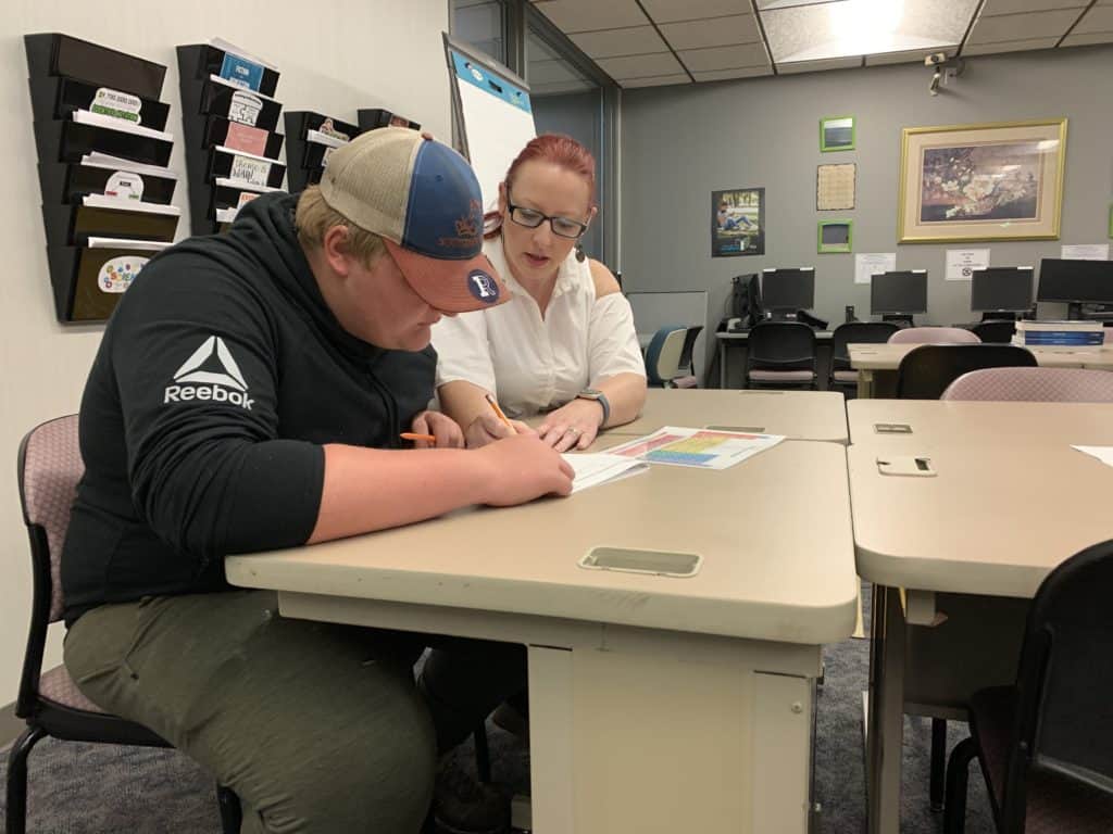OFTC Adult Education student, Jasper Smith, working with instructor, Cecila Swanson to complete his high school equivalency.